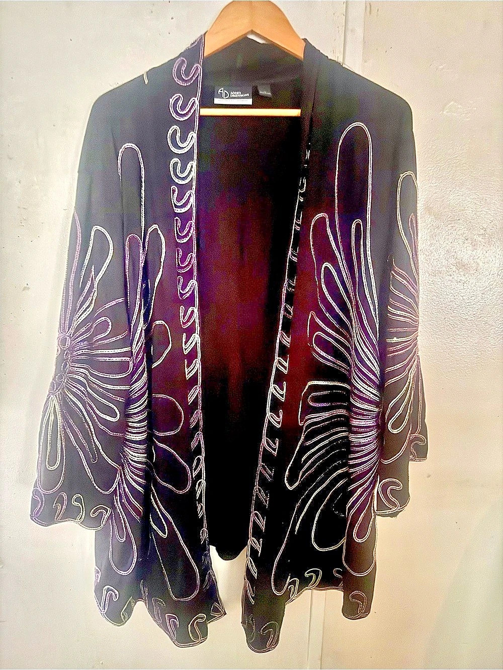 Added Dimensions Embroidered Abstract Cape in Black & Pink